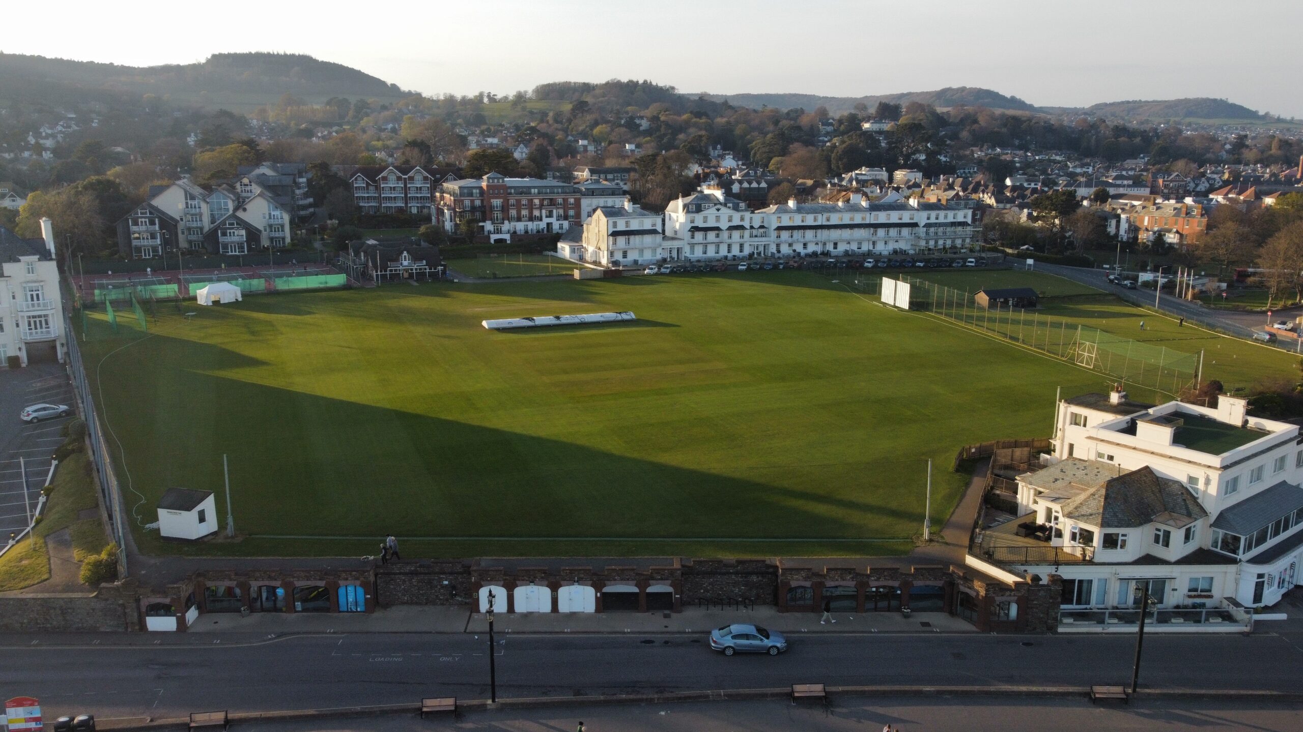 The Fortfield ground from the air — cricket pitch, tennis courts and the town of Sidmouth